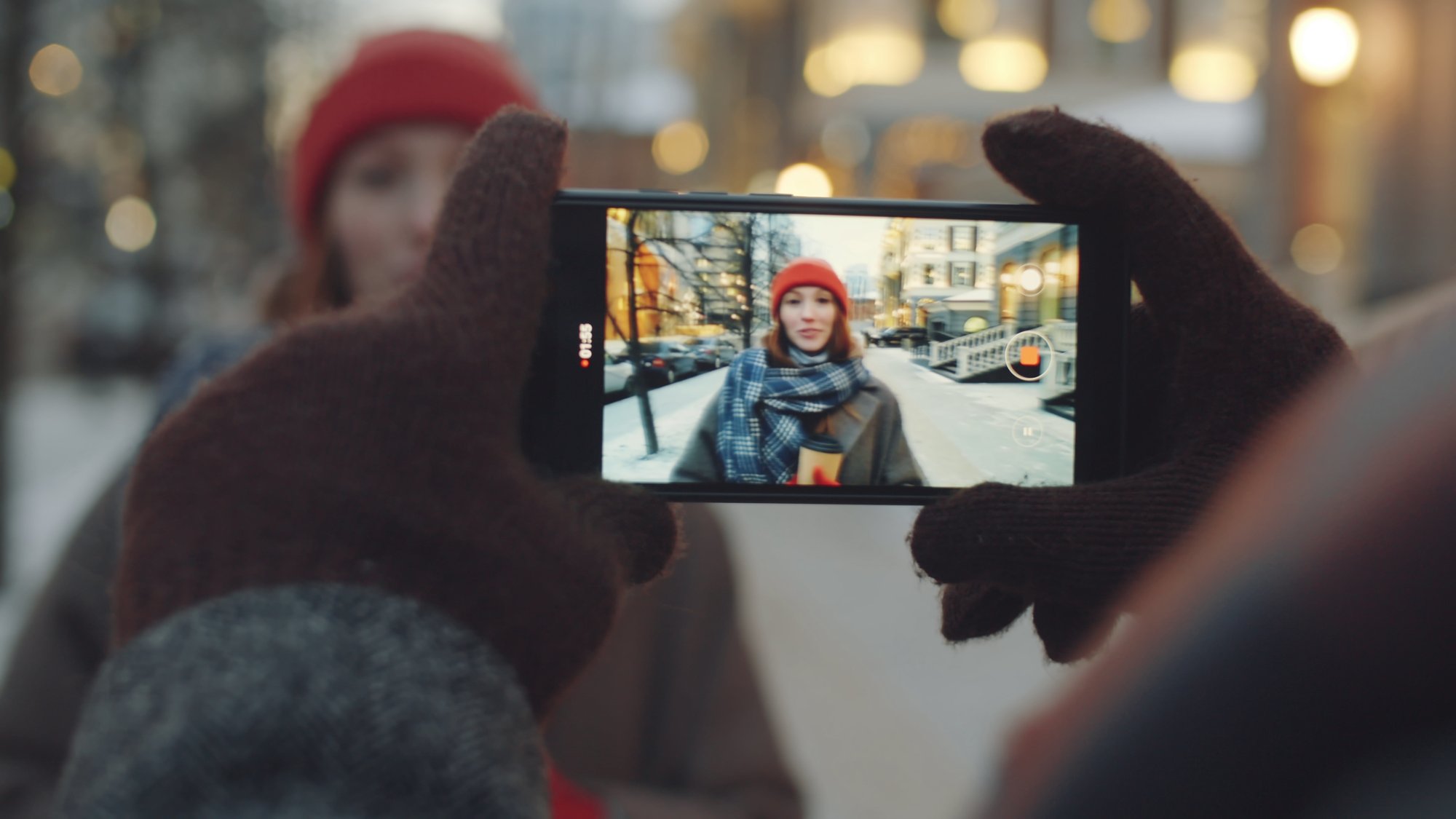 selective-focus-shot-of-young-pretty-woman-smiling-waving-and-posing-for-camera-on-cit-SBI-351191595